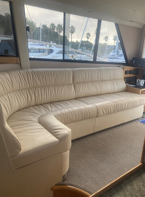 Custom marine lounge seating overlooking a marina