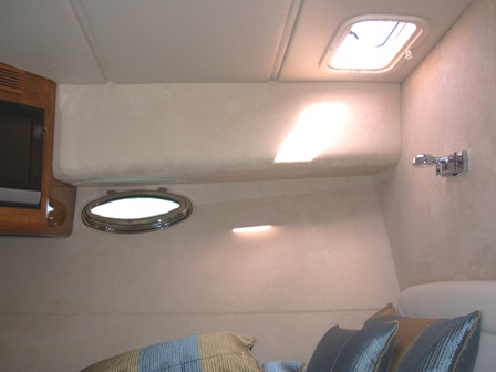 Custom light-coloured hull lining inside a boat cabin